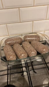 a glass baking dish of haggis sitting on top of an oven