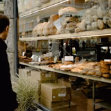Person_looking_in_bakery_window_Copenhagen