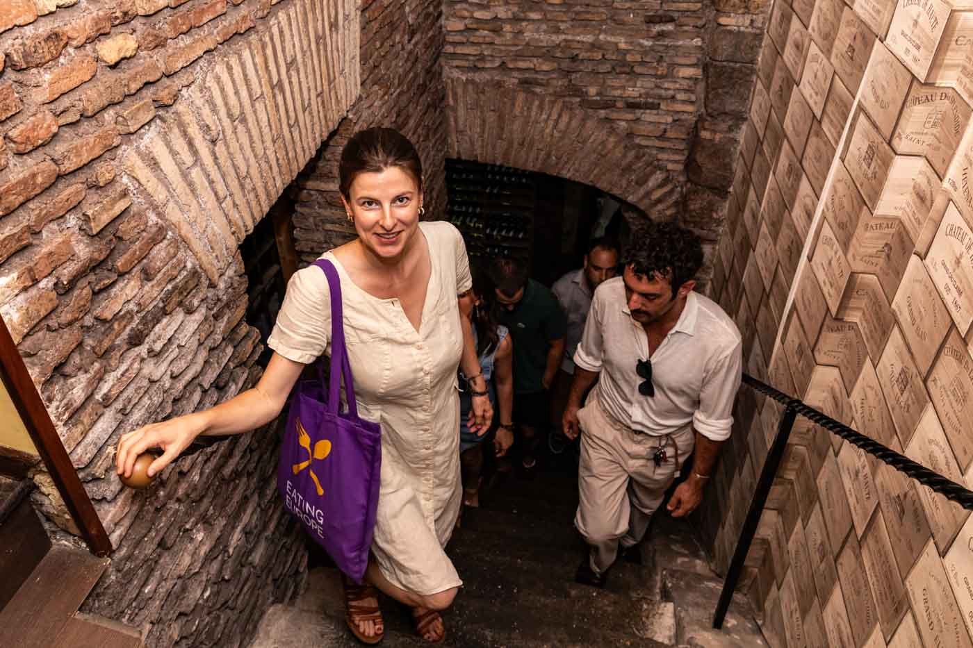 Tour_group_walking_up_the_stairs_at_Spirito_DiVino_Rome